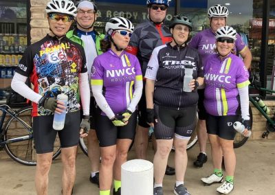 Cycling In Houston - NWCC Recent Activities Gallery 108 Vibrant cycling team members in NWCC Houston jerseys, ready for bike ride.