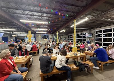 Cycling In Houston - NWCC Recent Activities Gallery 93 Spacious indoor bar and dining area at Northwest Cycling Club with cyclists and members socializing.