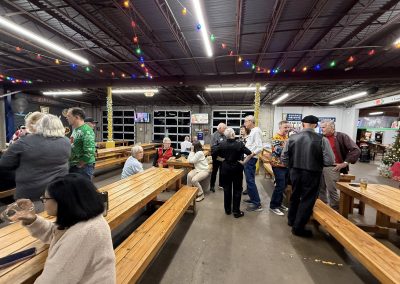 Cycling In Houston - NWCC Recent Activities Gallery 102 Vibrant indoor gathering of Northwest Cycling Club members celebrating with festive holiday cheer and socializing.