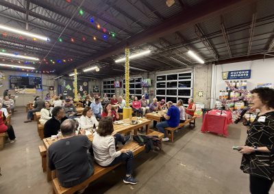 Cycling In Houston - NWCC Recent Activities Gallery 94 Community cycling club event with people gathered at Northwest Cycling Club in a spacious indoor setting.