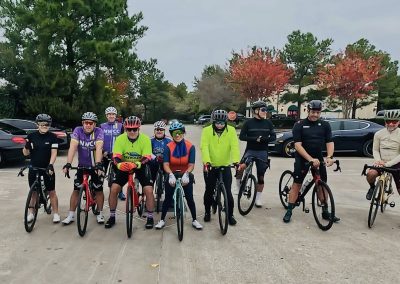 Cycling In Houston - NWCC Recent Activities Gallery 43 Group of cyclists in colorful gear at Northwest Cycling Club event.