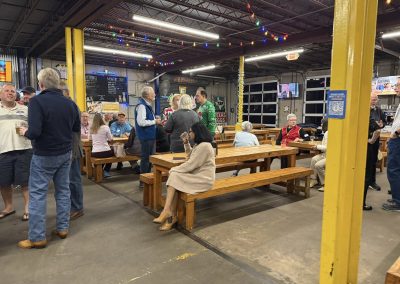 Cycling In Houston - NWCC Recent Activities Gallery 77 Community gathering at Northwest Cycling Club event with friends and cyclists indoors.