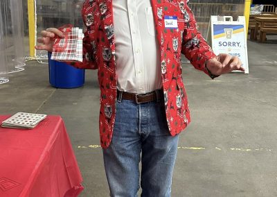 Cycling In Houston - NWCC Recent Activities Gallery 50 Festive man wearing Christmas-themed blazer at Northwest Cycling Club event.