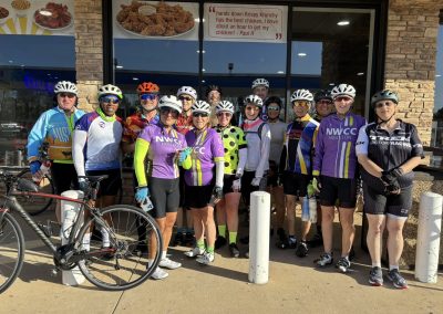 Cycling In Houston - NWCC Recent Activities Gallery 36 Group of cyclists posing outside a restaurant, members of Northwest Cycling Club Houston.