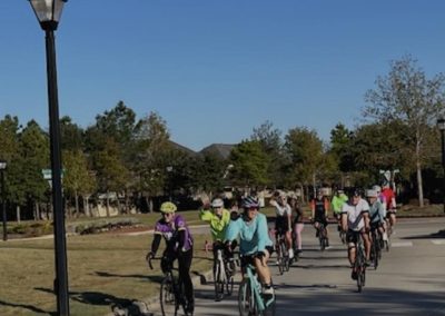 Cycling In Houston - NWCC Recent Activities Gallery 30 Cyclists Riding Together on a Community Bike Trail for Northwest Cycling Club Promotion.